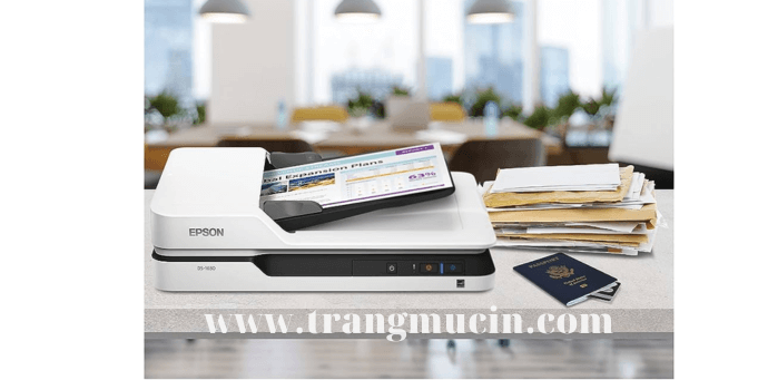 bên cạnh máy scan epson ds-1630 là một xấp tài liệu với quyển hộ chiếu