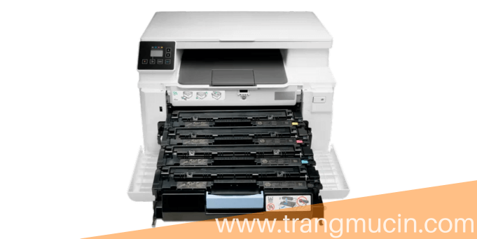 thay mực cho máy in HP Color laserjet pro mfp 182n lên bàn làm việc cạnh chậu cây 